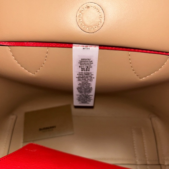 Authentic Burberry medium-sized tote in red, featuring gold studs on the front. - Picture 9 of 11